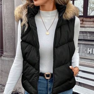 Black puffer vest with fur-trimmed hood